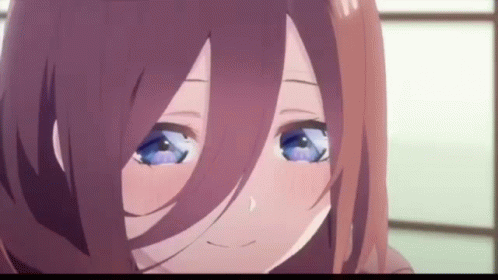 A Close Up Of A Anime Girl With Blue Eyes And Brown Hair . GIF