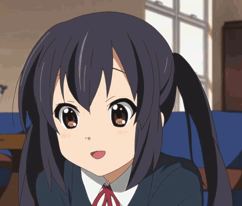 A Close Up Of A Anime Girl With Pigtails GIF