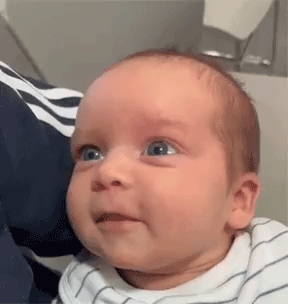 A Close Up Of A Baby Making A Funny Face . GIF