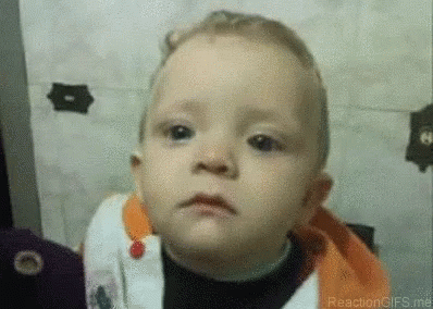 A Close Up Of A Baby Making A Funny Face . GIF