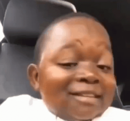 A Close Up Of A Baby Making A Funny Face In A Car . GIF