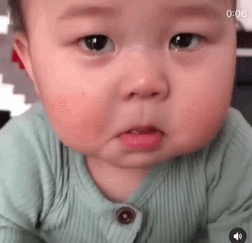 A Close Up Of A Baby Making A Funny Face . GIF