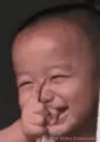 A Close Up Of A Baby Making A Funny Face With The Words Box Video Downloader On The Bottom GIF