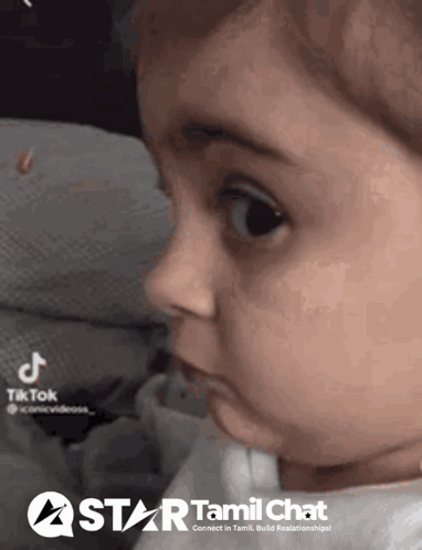 A Close Up Of A Baby 'S Face With A Tiktok Logo In The Corner . GIF