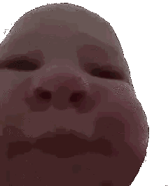 a close up of a baby 's face with a white background