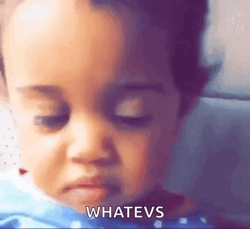 A Close Up Of A Baby 'S Face With The Words Whatevs Written On The Bottom GIF
