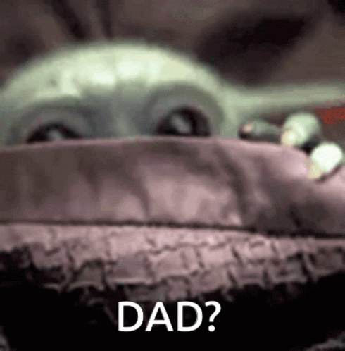 A Close Up Of A Baby Yoda With The Words `` Dad '' Written Next To It . GIF