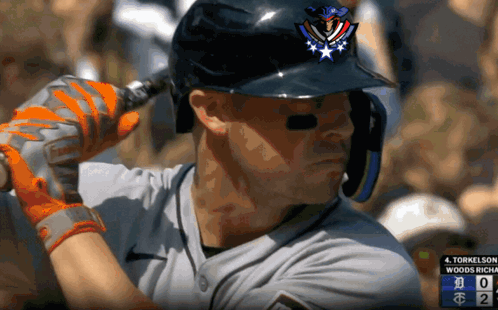 a close up of a baseball player wearing a helmet and gloves