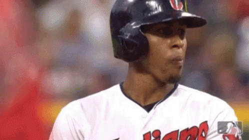 A Close Up Of A Baseball Player Wearing A Helmet And Sunglasses . GIF