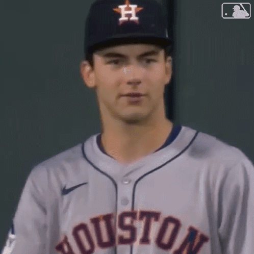 A Close Up Of A Baseball Player Wearing A Houston Jersey And Hat GIF