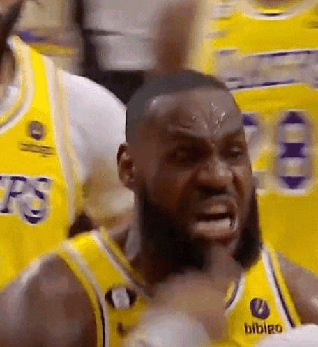 A Close Up Of A Basketball Player Making A Funny Face While Wearing A Yellow Jersey . GIF