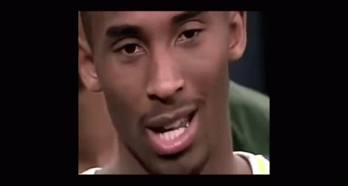 a close up of a basketball player talking into a microphone