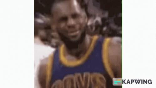 A Close Up Of A Basketball Player Wearing A Blue And Gold Uniform . GIF
