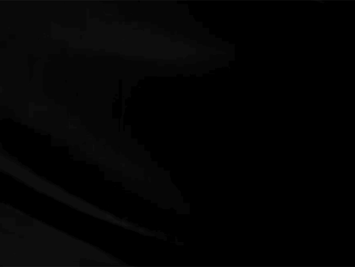 A Close Up Of A Black Cloth Moving In The Wind On A Black Background . GIF