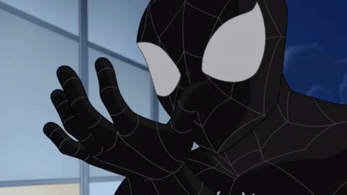 A Close Up Of A Black Spider Man 'S Face And Hands GIF