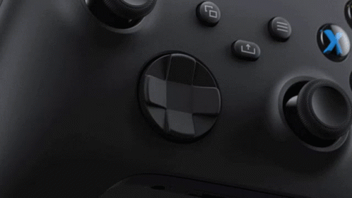 A Close Up Of A Black Xbox Controller With A Blue X On The Bottom Right GIF