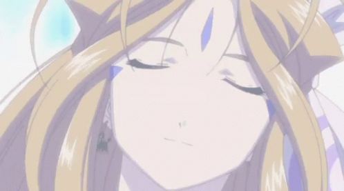 A Close Up Of A Blonde Anime Girl With Her Eyes Closed GIF