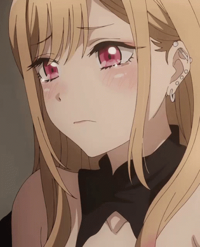 A Close Up Of A Blonde Anime Girl With Red Eyes And A Piercing In Her Ear GIF