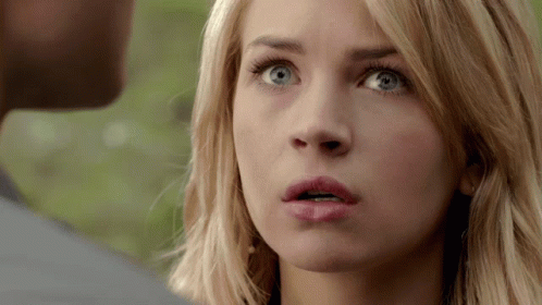 Blonde Woman With Blue Eyes Close Up GIF