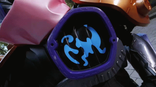 A Close Up Of A Blue And Purple Item With A Monkey On It GIF