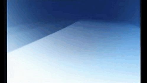 a close up of a blue and white background