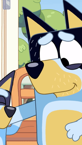 A Close Up Of A Blue And Yellow Cartoon Dog 'S Face GIF