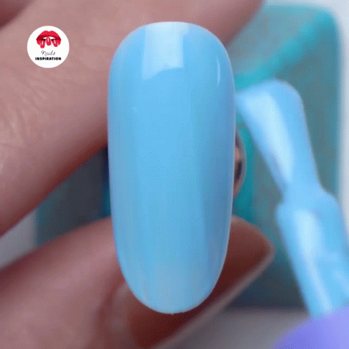 a close up of a blue nail with a red sticker that says rude inspiration on it