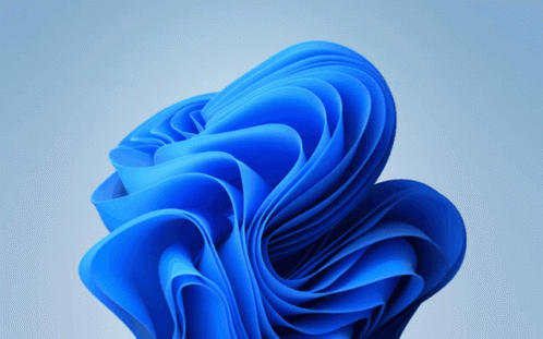 A Close Up Of A Blue Swirl On A Light Blue Background GIF