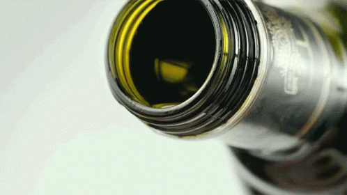 A Close Up Of A Bottle With A Label That Says Carlsberg On It GIF