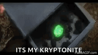 A Close Up Of A Box With A Green Glowing Object In It And The Words `` It 'S My Kryptonite '' . GIF