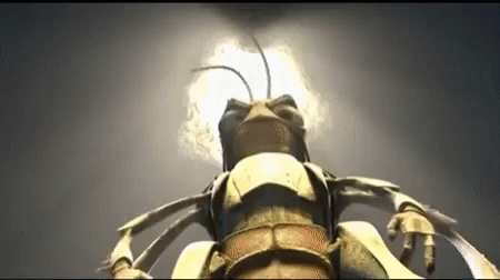 A Close Up Of A Bug With A Light Coming Out Of It 'S Head GIF