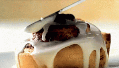 A Close Up Of A Cake With Icing On It GIF