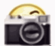 A Close Up Of A Camera With A Smiley Face On Top Of It . GIF