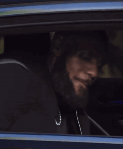 a close up of a car window with a person looking out