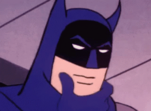 A Close Up Of A Cartoon Batman Thinking With His Hand On His Chin GIF