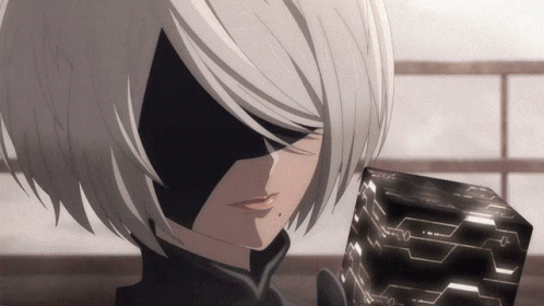 A Close Up Of A Cartoon Character Holding A Black Cube GIF