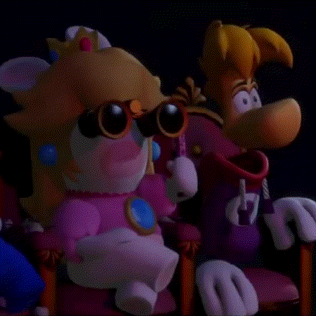 A Close Up Of A Cartoon Character , Peach , And Rayman , Standing Next To Each Other . GIF
