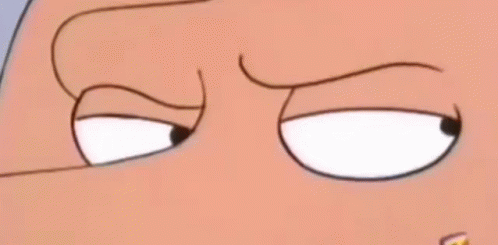 A Close Up Of A Cartoon Character 'S Eyes With A Slight Smirk On His Face . GIF