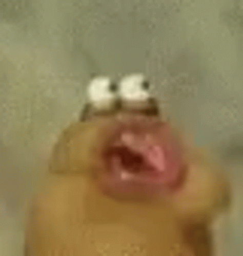 A Close Up Of A Cartoon Character 'S Face With A Mouth Open . GIF