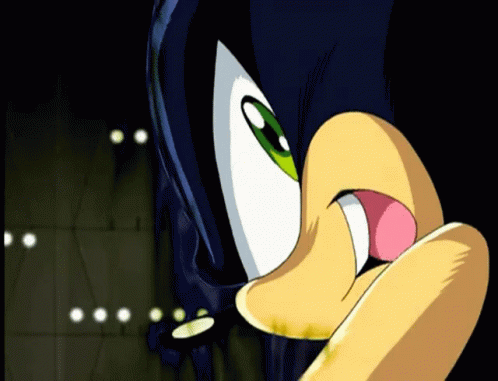 A Close Up Of A Cartoon Character 'S Face With A Pink Tongue Sticking Out GIF