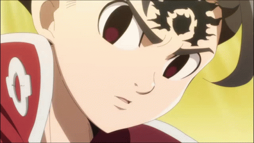 A Close Up Of A Cartoon Character 'S Face With A Shield On His Shoulder GIF