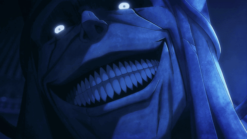 A Close Up Of A Cartoon Character 'S Face With Glowing Eyes And Teeth GIF