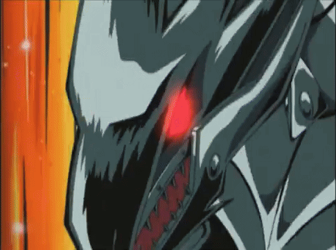 A Close Up Of A Cartoon Character 'S Face With Red Eyes And Sharp Teeth . GIF