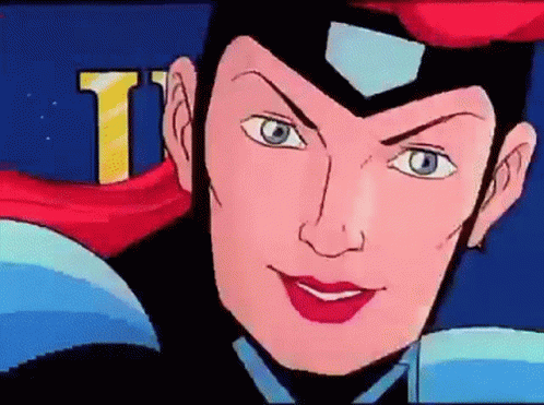 A Close Up Of A Cartoon Character 'S Face With The Letter T Visible In The Background GIF