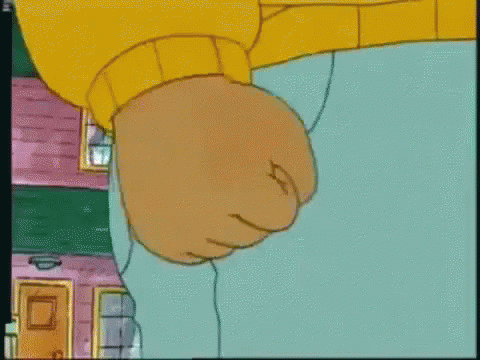 A Close Up Of A Cartoon Character 'S Fist In A Yellow Sweater GIF