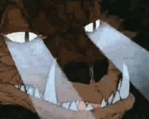 A Close Up Of A Cartoon Character 'S Mouth And Eyes With A Light Coming Out Of It . GIF