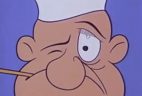 A Close Up Of A Cartoon Character Wearing A Chef 'S Hat And Holding A Fork In His Mouth . GIF