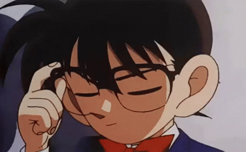 A Close Up Of A Cartoon Character Wearing Glasses And A Red Bow Tie . GIF