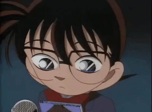 A Close Up Of A Cartoon Character Wearing Glasses Holding A Microphone . GIF