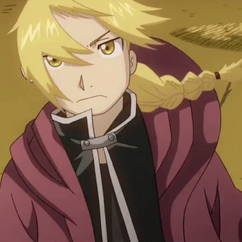 A Close Up Of A Cartoon Character With A Braid And The Letter M On His Face GIF